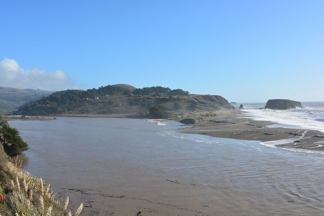 Broad, quiet estuary waters where the Russian River slips toward the Pacific