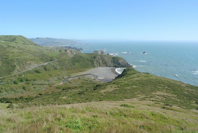 Highway 1 winds north from Jenner across green headlands above the Pacific
